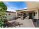 Spacious outdoor patio featuring a shaded seating area with modern furniture and privacy wall at 421 Leisure World --, Mesa, AZ 85206