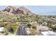 Scenic aerial view of neighborhood homes nestled beneath Camelback Mountain in beautiful Scottsdale, Arizona at 4349 E Stanford Dr, Phoenix, AZ 85018