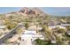 Stunning aerial view of Scottsdale home with a pool, set against the backdrop of iconic Camelback Mountain at 4349 E Stanford Dr, Phoenix, AZ 85018