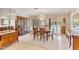 Elegant dining room featuring a chandelier and a large window with views of the pool at 4349 E Stanford Dr, Phoenix, AZ 85018