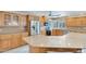 Close up of a large kitchen with quartz counters, stainless steel appliances, and wood cabinetry at 4349 E Stanford Dr, Phoenix, AZ 85018