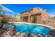 Backyard oasis featuring a sparkling pool, creating a perfect space for relaxation and entertainment at 4376 S Summit E St, Gilbert, AZ 85297