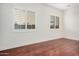 Inviting bedroom featuring hard wood flooring and plantation shutters at 4376 S Summit E St, Gilbert, AZ 85297