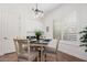 Cozy dining area featuring a table with chairs, modern lighting, and plantation shutters at 4376 S Summit E St, Gilbert, AZ 85297