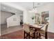 Inviting dining room with hardwood floors, a modern chandelier, and large shuttered windows at 4376 S Summit E St, Gilbert, AZ 85297