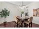 Bright dining room featuring hardwood floors, stylish lighting, and comfortable seating at 4376 S Summit E St, Gilbert, AZ 85297