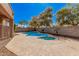 Backyard pool with a desert landscaped yard and a clear blue sky, creating a refreshing outdoor oasis at 4376 S Summit E St, Gilbert, AZ 85297