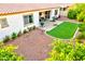 View of patio with turf area, grill, and lush greenery at 4545 S Ellesmere St, Gilbert, AZ 85297