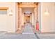 Inviting walkway to the front door, featuring stone accents and stylish lighting fixtures at 4545 S Ellesmere St, Gilbert, AZ 85297