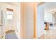 Hallway view of the Laundry Room with washer, dryer, and window to exterior at 4545 S Ellesmere St, Gilbert, AZ 85297