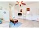 Bright living room features tile flooring, a ceiling fan, and ample natural light at 4545 S Ellesmere St, Gilbert, AZ 85297