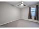 Empty bedroom ready for your vision, featuring a ceiling fan, neutral paint, and carpeted flooring at 4593 W Bush Bean Way, San Tan Valley, AZ 85144