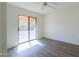 Serene bedroom featuring wood flooring and a sliding glass door to the outdoor area at 4843 W Del Rio St, Chandler, AZ 85226