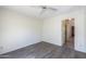 Spacious bedroom with wood-look vinyl flooring and ceiling fan at 4843 W Del Rio St, Chandler, AZ 85226