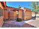 Beige home exterior with a well-maintained walkway and green landscaping at 4843 W Del Rio St, Chandler, AZ 85226