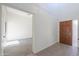 Bright entry foyer with tiled flooring, high ceilings, and entry door at 4843 W Del Rio St, Chandler, AZ 85226