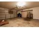 Spacious garage with a garage door, a water heater, and plenty of storage space at 4843 W Del Rio St, Chandler, AZ 85226