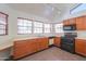 Kitchen featuring oak cabinets, tile floors, and modern appliances at 4843 W Del Rio St, Chandler, AZ 85226