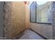 Exterior patio area with a view of a wall, a stand up shower and desert landscaping at 4843 W Del Rio St, Chandler, AZ 85226