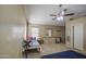 Inviting bedroom boasting a ceiling fan, comfortable carpet, and a dresser with a mirror at 5071 W Warren Dr, Casa Grande, AZ 85194