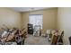 Bedroom with carpeted floors, a window for natural light, and disorganized clutter at 5071 W Warren Dr, Casa Grande, AZ 85194