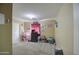 Bright bedroom featuring neutral walls, plush carpet, and lots of natural light at 5071 W Warren Dr, Casa Grande, AZ 85194