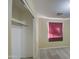 A simple carpeted bedroom features a window with blinds and a built-in closet with a wooden rail at 5071 W Warren Dr, Casa Grande, AZ 85194