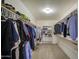 Walk in closet with carpeted floor, overhead light, and shelving for folded clothes at 5071 W Warren Dr, Casa Grande, AZ 85194