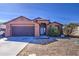 Charming single-story home with a well-maintained front yard and attached two-car garage at 5071 W Warren Dr, Casa Grande, AZ 85194