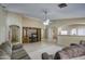 Spacious living room with neutral walls, ceiling fan, and plenty of natural light at 5071 W Warren Dr, Casa Grande, AZ 85194