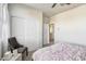 Bright bedroom featuring a plush bed, accent chair, modern decor, a large window and soft carpet at 5106 E Umber Rd, San Tan Valley, AZ 85143