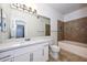 Modern bathroom featuring a tub, shower, and quartz counters, providing a spa-like experience at 5335 E Shea Blvd # 2126, Scottsdale, AZ 85254