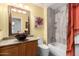 Stylish bathroom featuring a modern vanity, unique sink, and tiled shower-tub combination at 5462 W Geronimo St, Chandler, AZ 85226