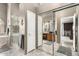 A clean and well-lit bathroom featuring double sinks, a soaking tub, and a separate shower at 5462 W Geronimo St, Chandler, AZ 85226