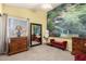 Bedroom featuring a mural accent wall, ample natural light, and a red decorative bench at 5462 W Geronimo St, Chandler, AZ 85226