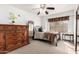 Cozy bedroom with a decorative dresser and a window letting in natural light, creating a calm atmosphere at 5462 W Geronimo St, Chandler, AZ 85226