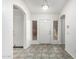 Inviting foyer with neutral tile flooring and abundant natural light, a welcoming entrance to the home at 5462 W Geronimo St, Chandler, AZ 85226