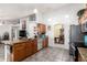 Open concept kitchen with granite countertops, stainless steel appliances, and tile flooring at 5462 W Geronimo St, Chandler, AZ 85226