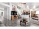 The living room features tile flooring, an entertainment center and opens to the kitchen at 5462 W Geronimo St, Chandler, AZ 85226