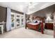 A well-appointed main bedroom with a ceiling fan and a view of the pool at 5462 W Geronimo St, Chandler, AZ 85226