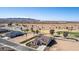 Desert home with outdoor entertaining area, mountain views, and mature palm trees at 5550 N Luna Dr, Eloy, AZ 85131