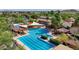 Aerial view of the community pool featuring lap lanes, lounge areas, and various outdoor amenities at 5550 N Luna Dr, Eloy, AZ 85131