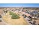 A view of several homes surrounding a manicured desert golf course in a desert setting at 5550 N Luna Dr, Eloy, AZ 85131