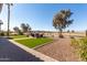 A well-maintained backyard with turf grass and desert landscaping, ideal for outdoor enjoyment at 5550 N Luna Dr, Eloy, AZ 85131