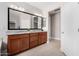 Bright bathroom with a double sink vanity, granite countertop and large framed mirrors at 5550 N Luna Dr, Eloy, AZ 85131