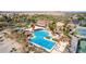 Aerial view of the community pool area featuring lap lanes, lounging areas and shaded seating at 5550 N Luna Dr, Eloy, AZ 85131