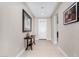 Bright entryway features neutral colors, tile floors, and an accent table with decor at 5550 N Luna Dr, Eloy, AZ 85131