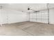 A spacious garage with an automatic door, perfect for parking and storage at 5550 N Luna Dr, Eloy, AZ 85131