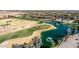 An aerial view of the golf course with ponds, sand traps, and desert landscaping at 5550 N Luna Dr, Eloy, AZ 85131