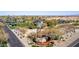 Community entrance sign at Robson Ranch with a windmill, landscaping, and views of the surrounding area at 5550 N Luna Dr, Eloy, AZ 85131